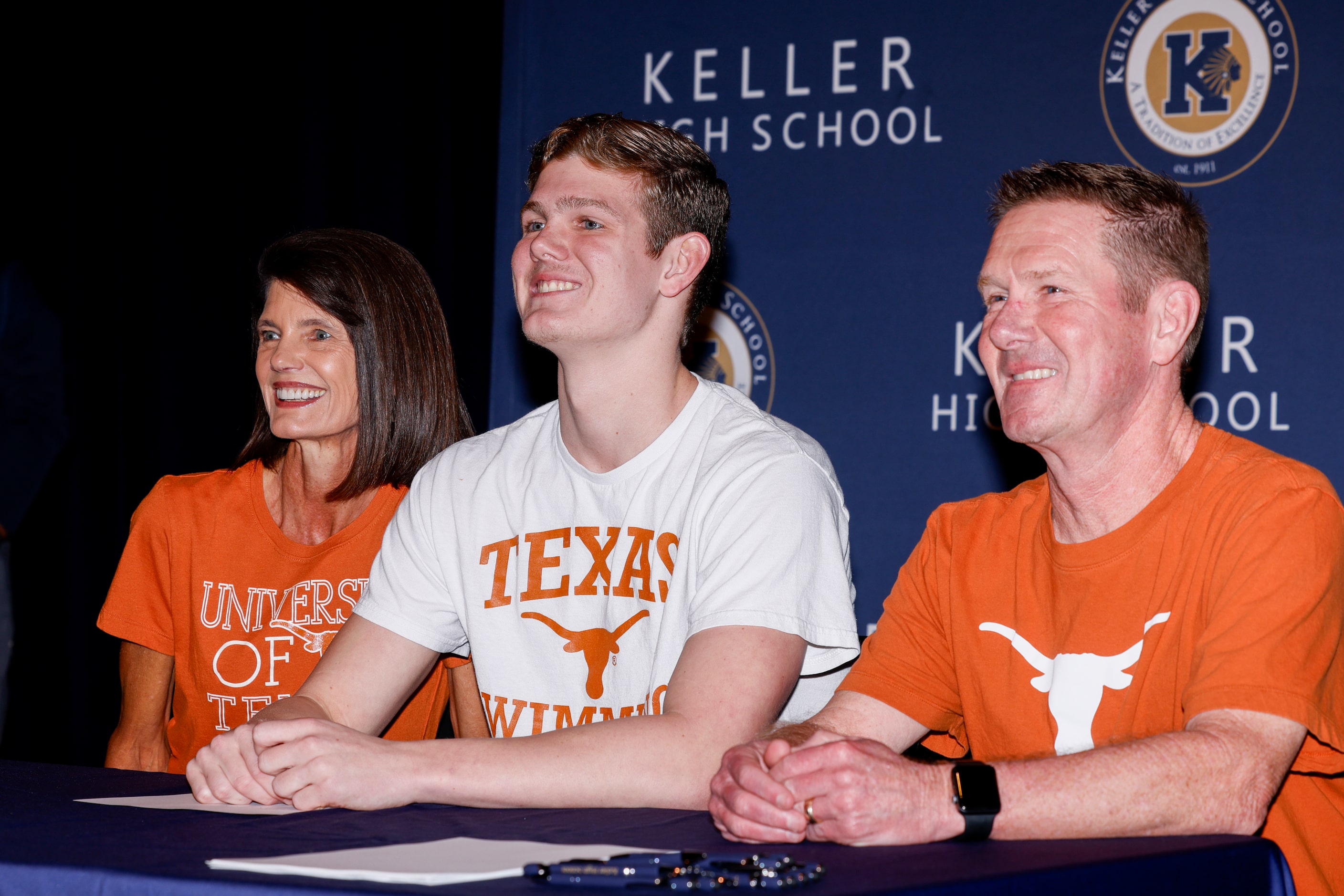 Keller swimmer Cooper Lucas poses for a photo with his parents Leslie Lucas (left) and Mark...