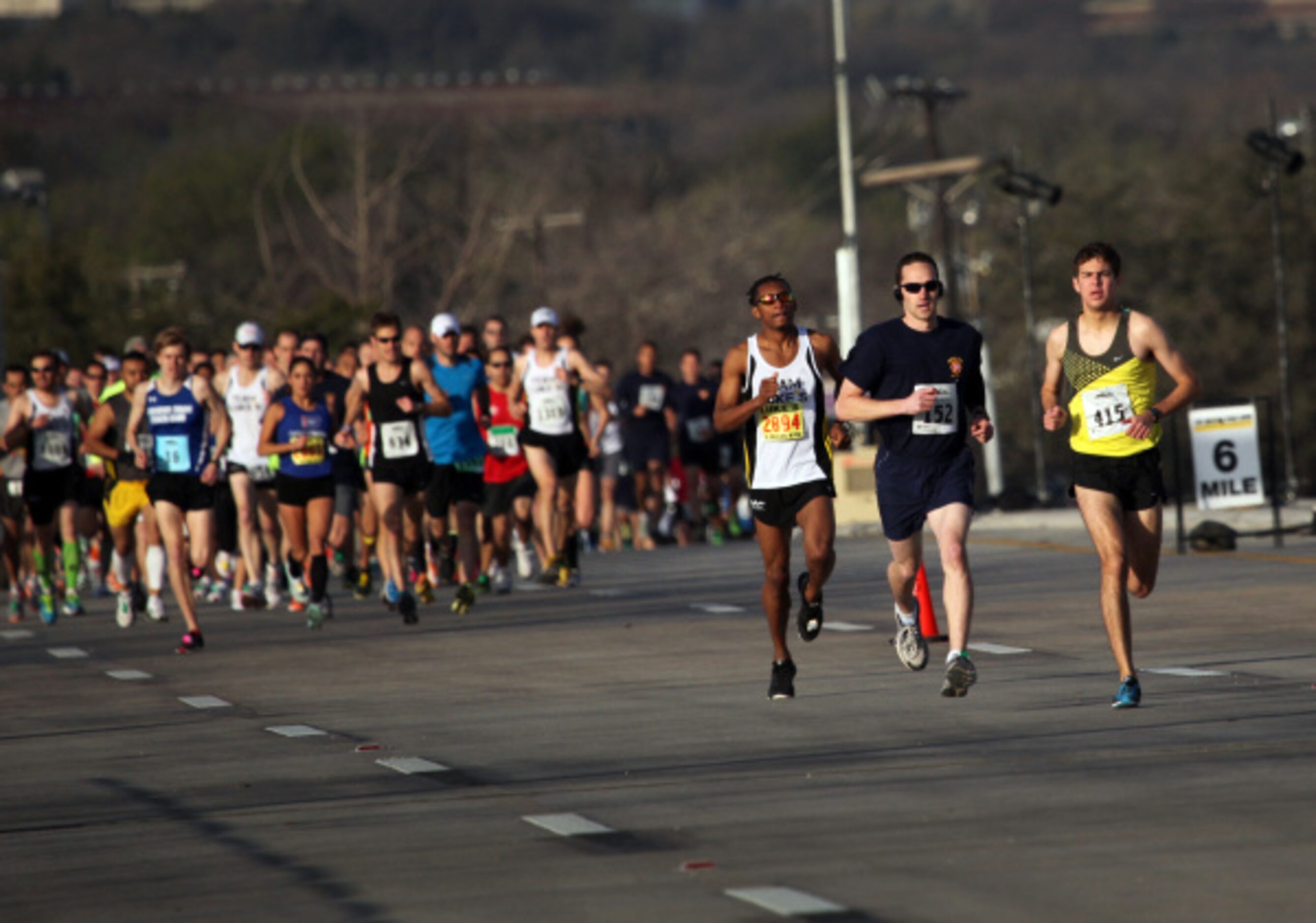 Participants run over the Margaret Hunt Hill Bridge in Dallas, TX during Trinity Sprint...