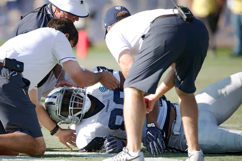 Dallas Cowboys tight end Rico Gathers (80) is tended to by Dallas Cowboys staff after a head...