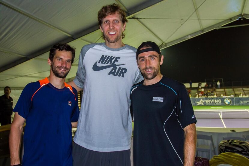 
Dirk Nowitzki visits with tennis players Philipp Petzschner (left) and Benjamin Becker...