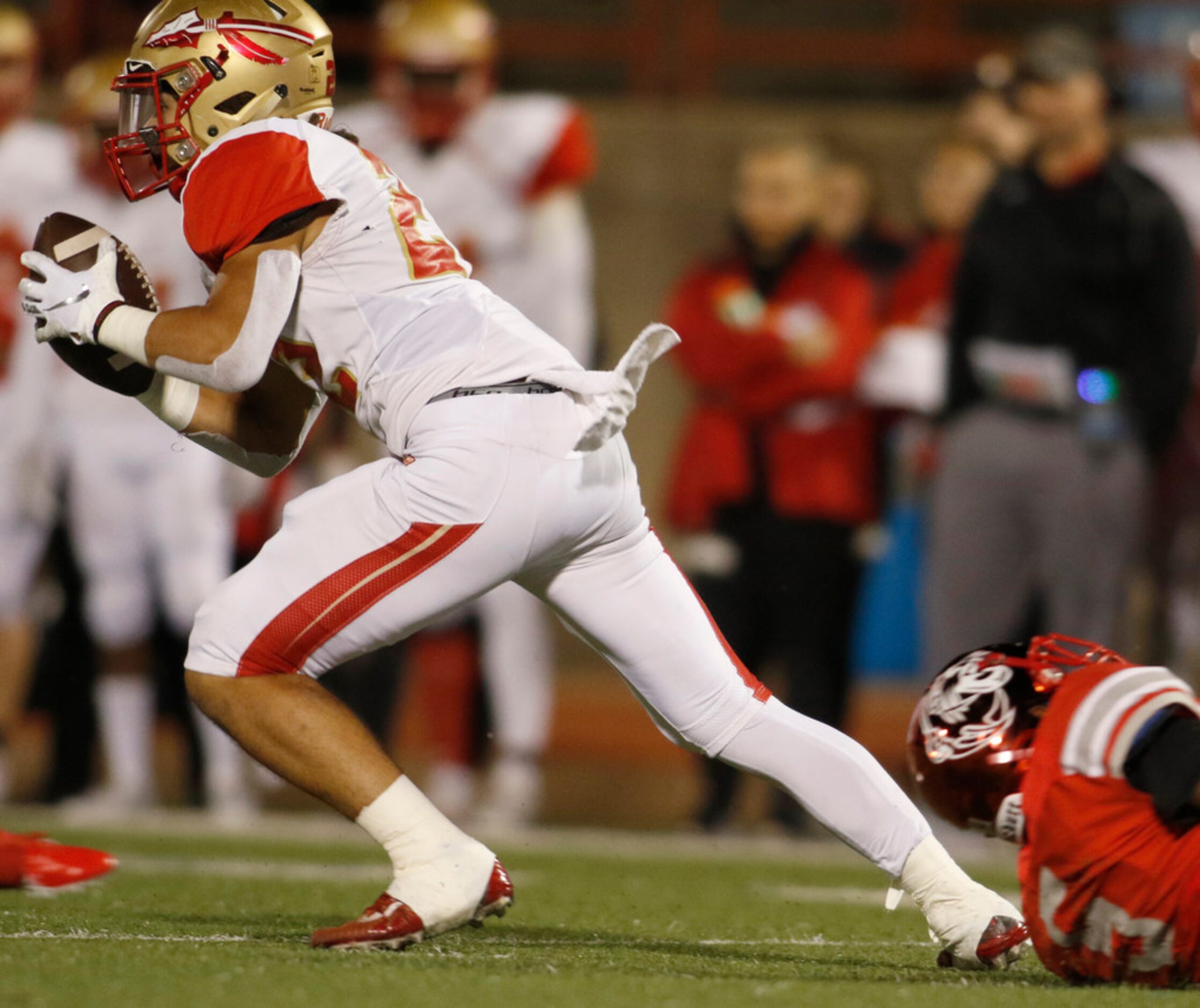 South Grand Prairie receiver Kendrick Young (22) pulls a away from an attempted tackle by...