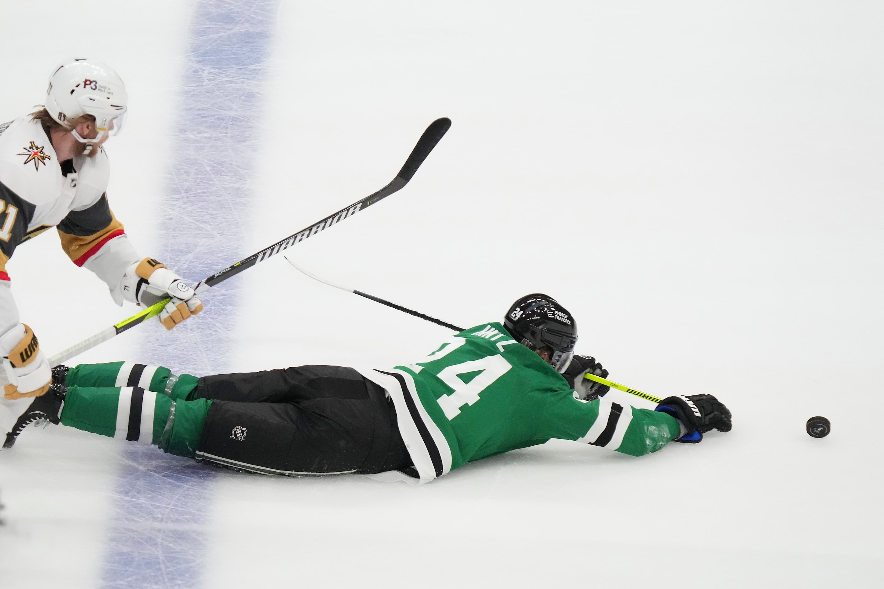 Dallas Stars center Roope Hintz (24) hits the ice in front of Vegas Golden Knights center...