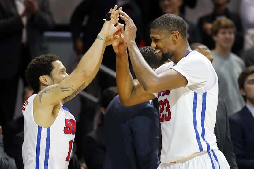 Southern Methodist Mustangs forward Jordan Tolbert (23) is congratulated by Southern...