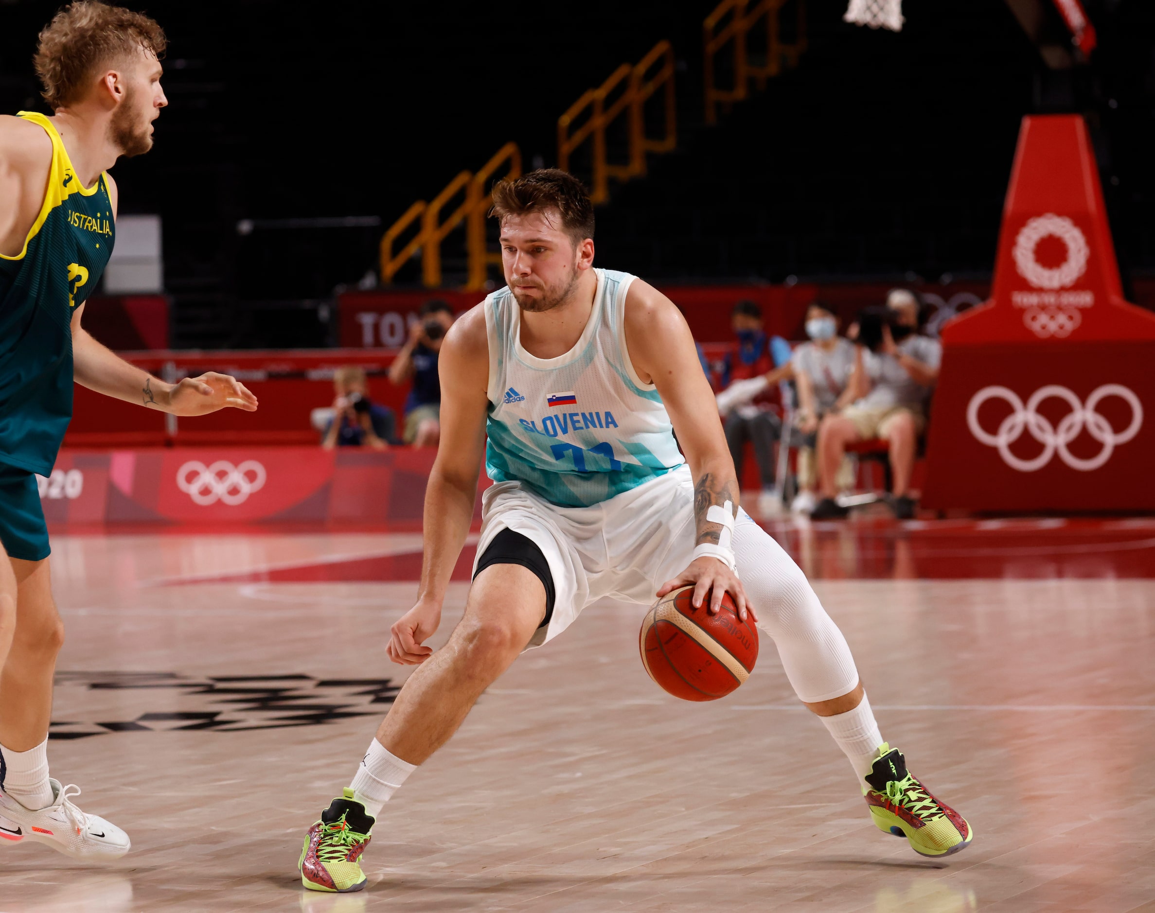 Slovenia’s Luka Doncic (77) dribbles in front of Australia’s Jock Landale (13) during the...