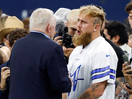 Boxer Jake Paul (right) visits with Dallas Cowboys owner Jerry Jones before the Cowboys...