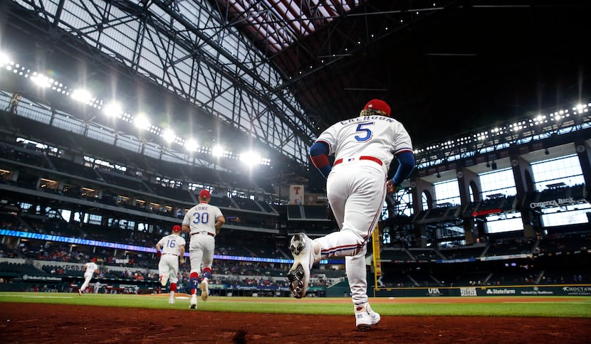 Texas Rangers left fielder Willie Calhoun (5) takes the field to face the Los Angeles Angels...