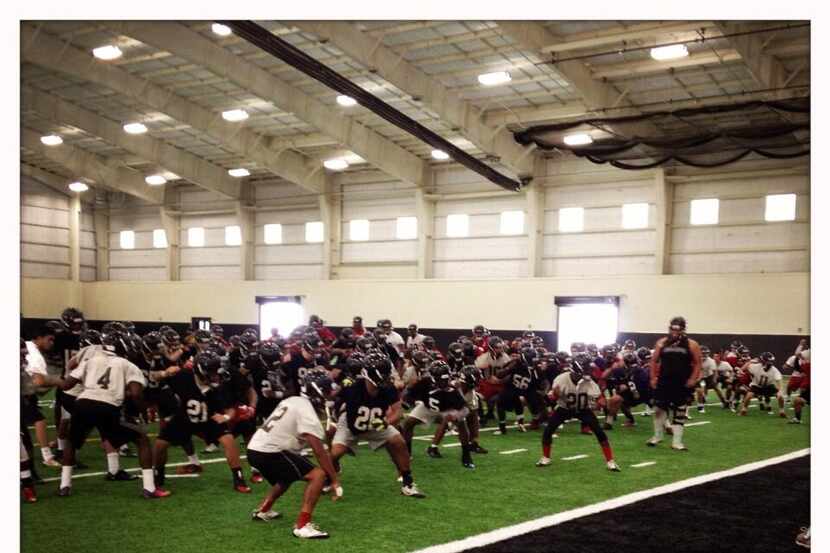 Euless Trinity players practicing the team's Sipi Tau after the first day of 2013 fall...