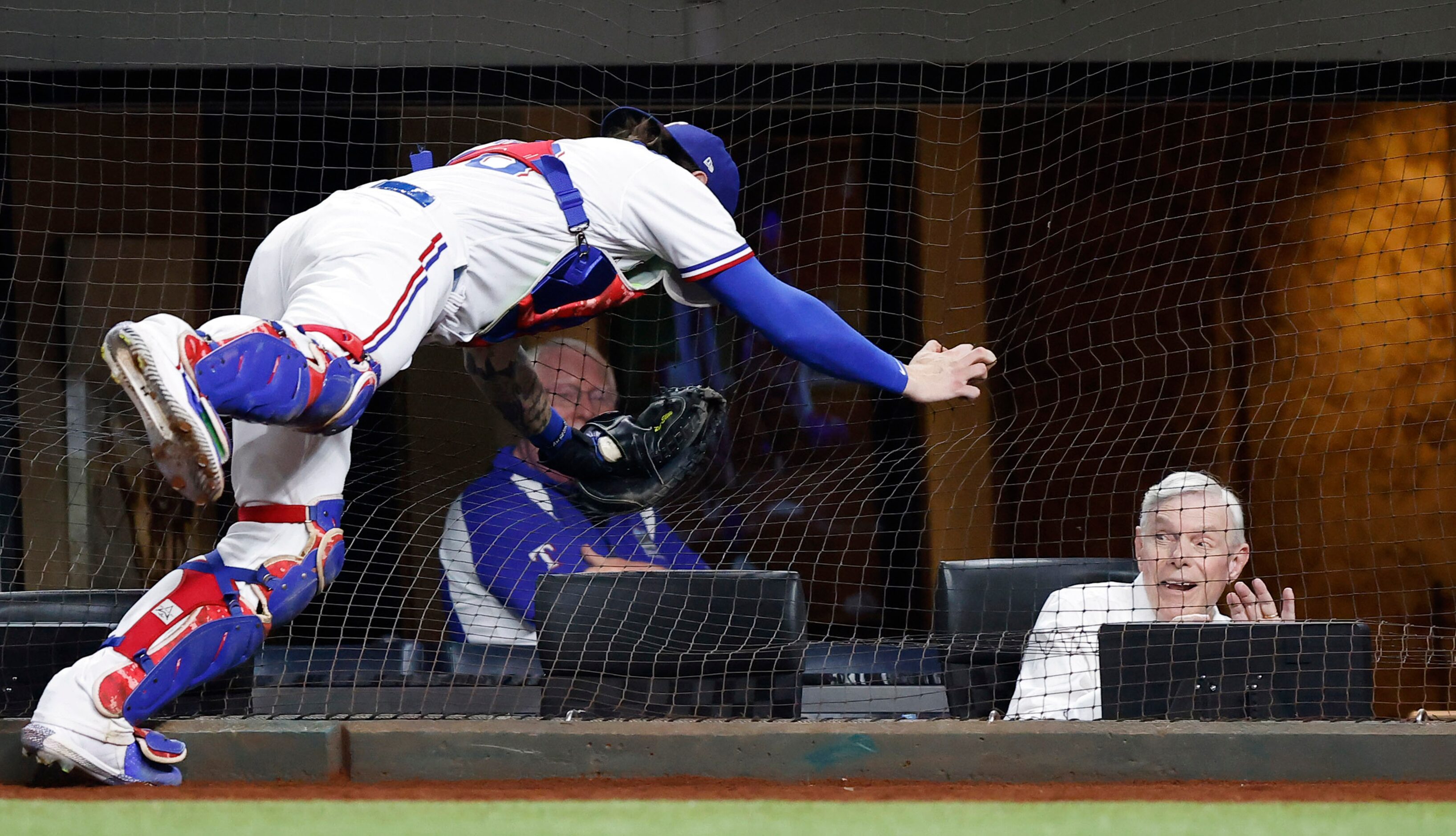 Texas Rangers co-owner and co-chairman Ray Davis reacts as Texas Rangers catcher Jonah Heim...