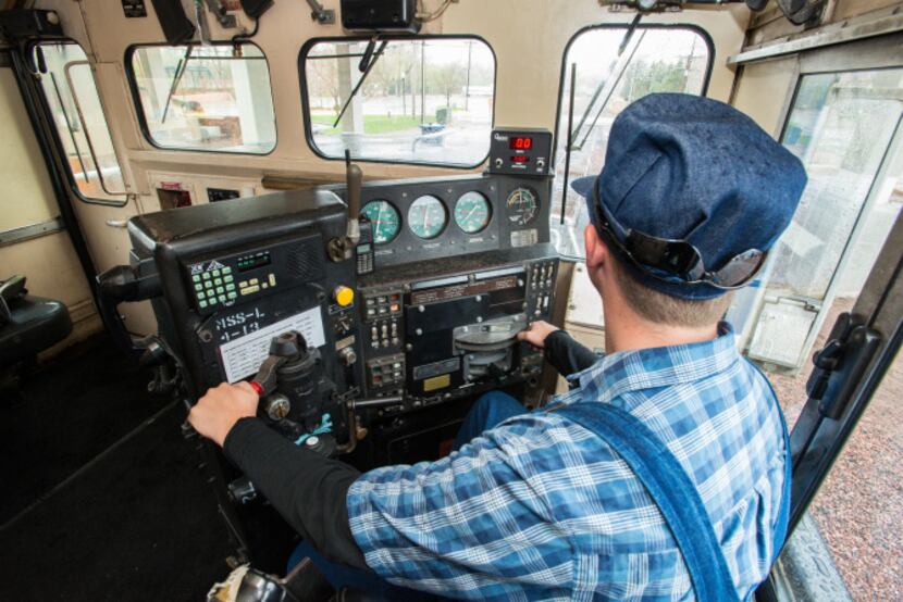 Engineer trainee Devon Cacy sits at the controls of the Royal Gorge Route Railroad's...
