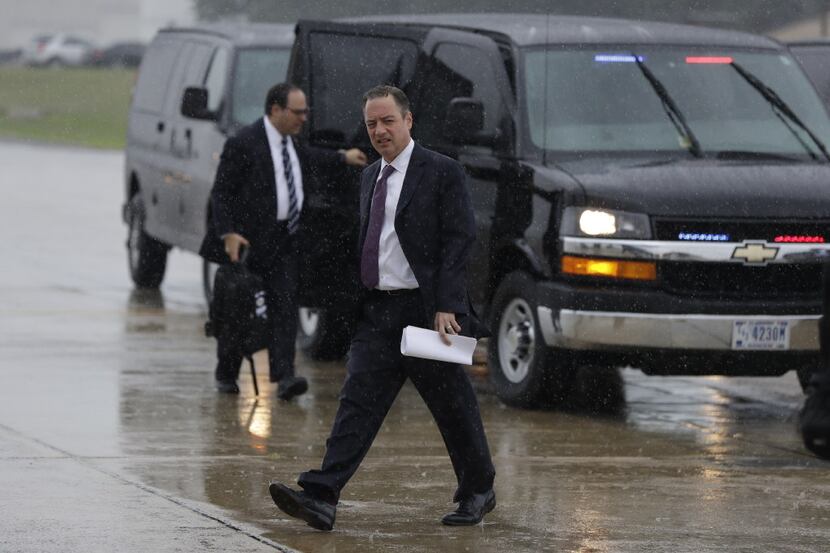 White House Chief of Staff Reince Priebus walks to boards Air Force One at Andrews Air Force...
