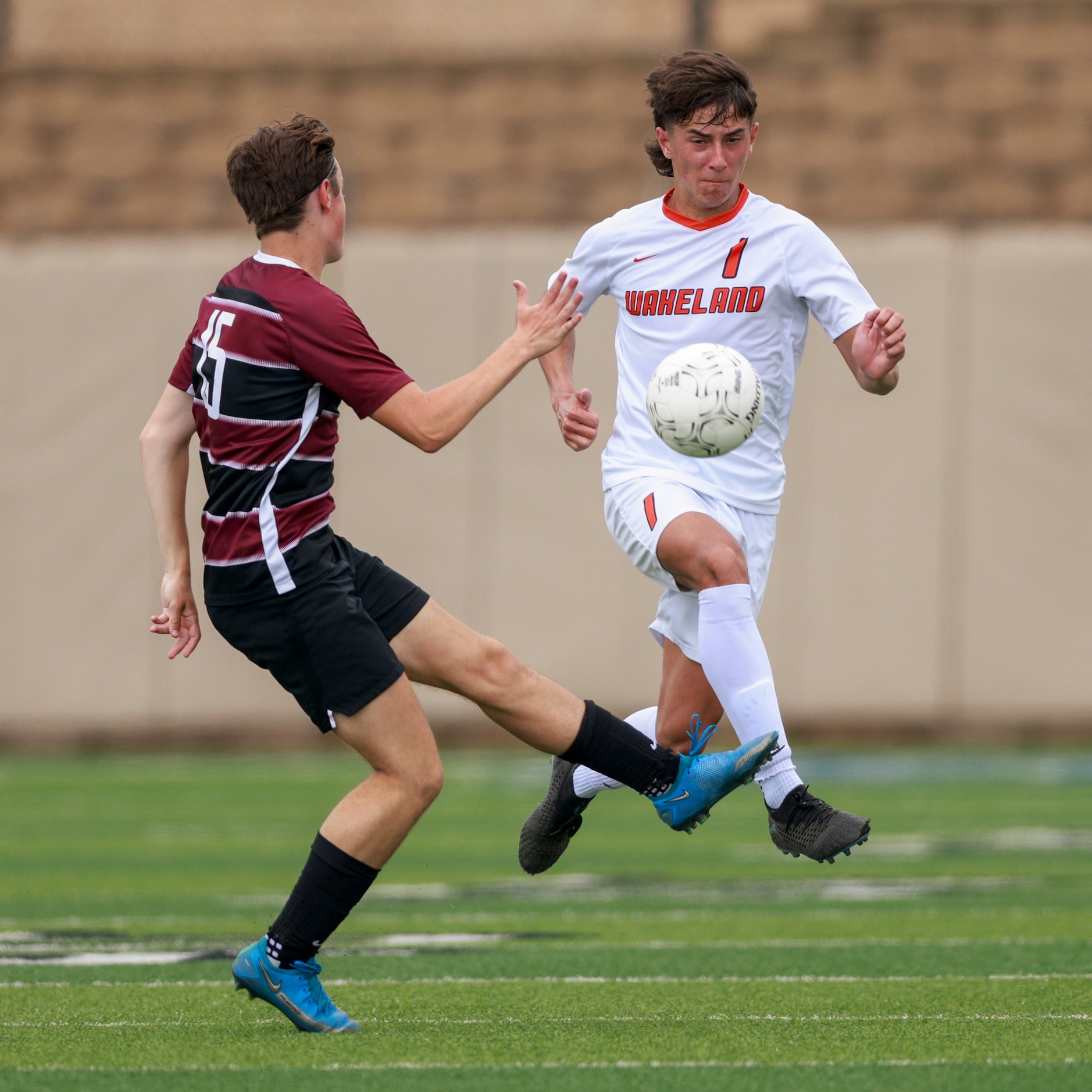 Dripping Springs forward York Merrill (15) and Frisco Wakeland defender Riley Garza (1) go...