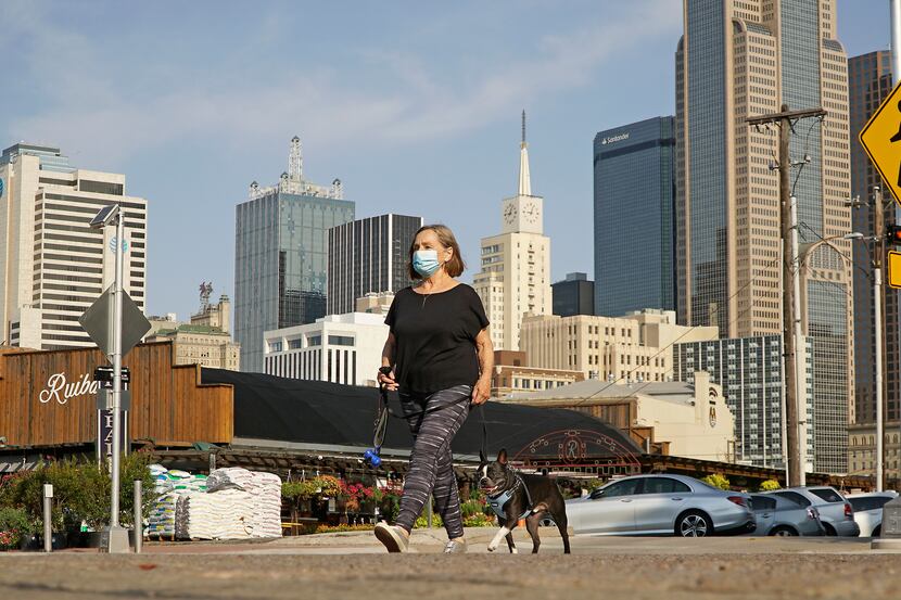 Judith “J” Maisel and her dog, Clancy, take a morning stroll near the Farmers Market in...