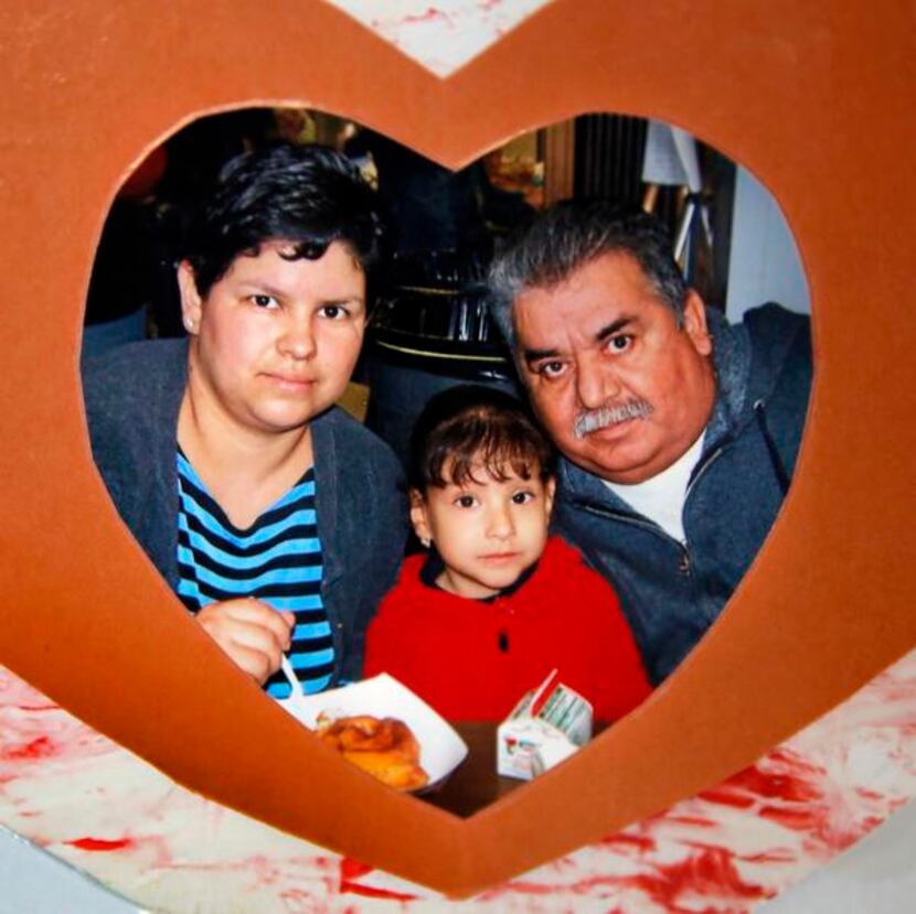 
A photo of Mariano Saldivar with his wife and daughter hangs on the refrigerator in the...