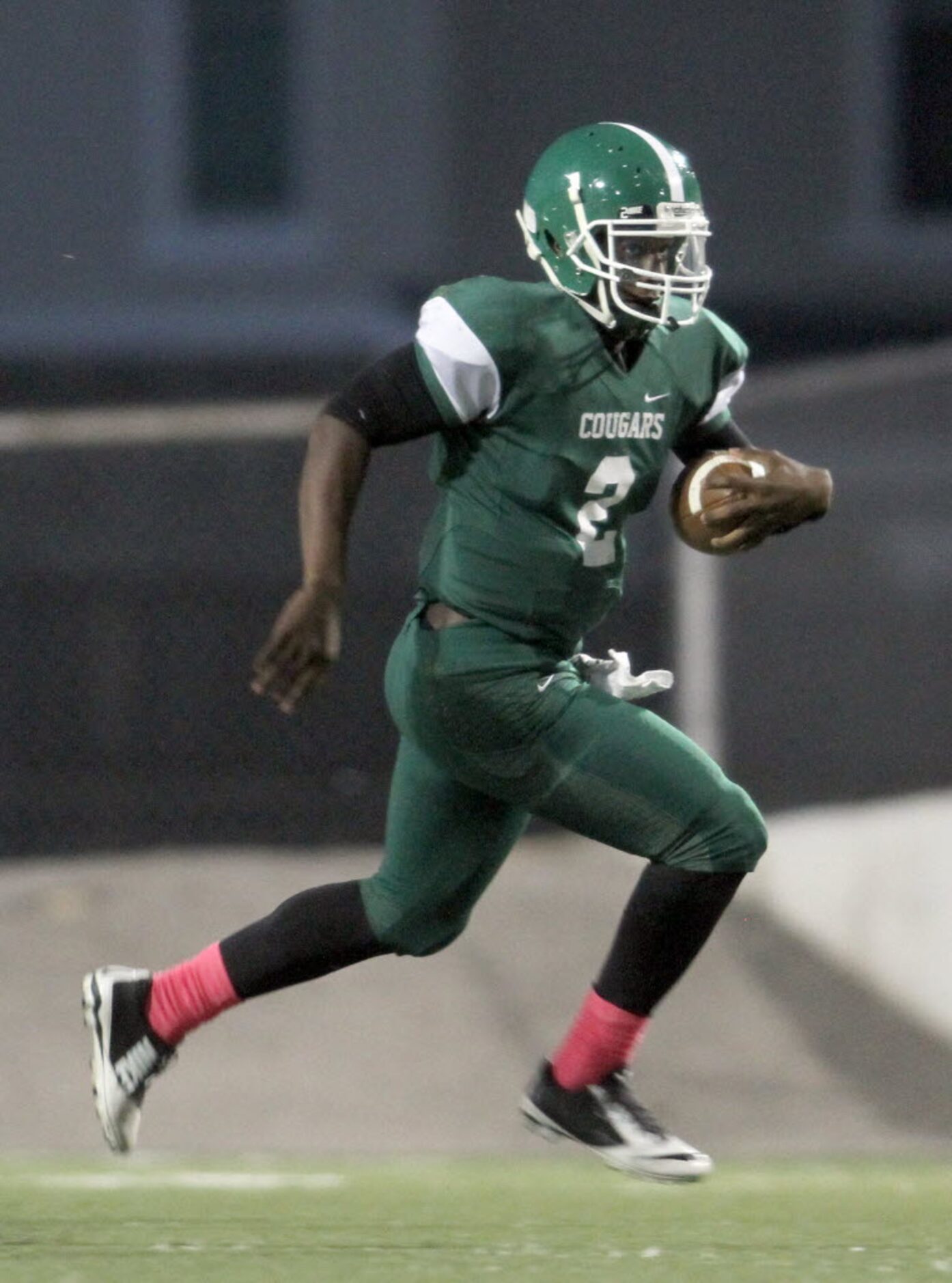 Bryan Adams quarterback XaiyViyon Mccuin, (2) follows his blockers as he rambles into the...