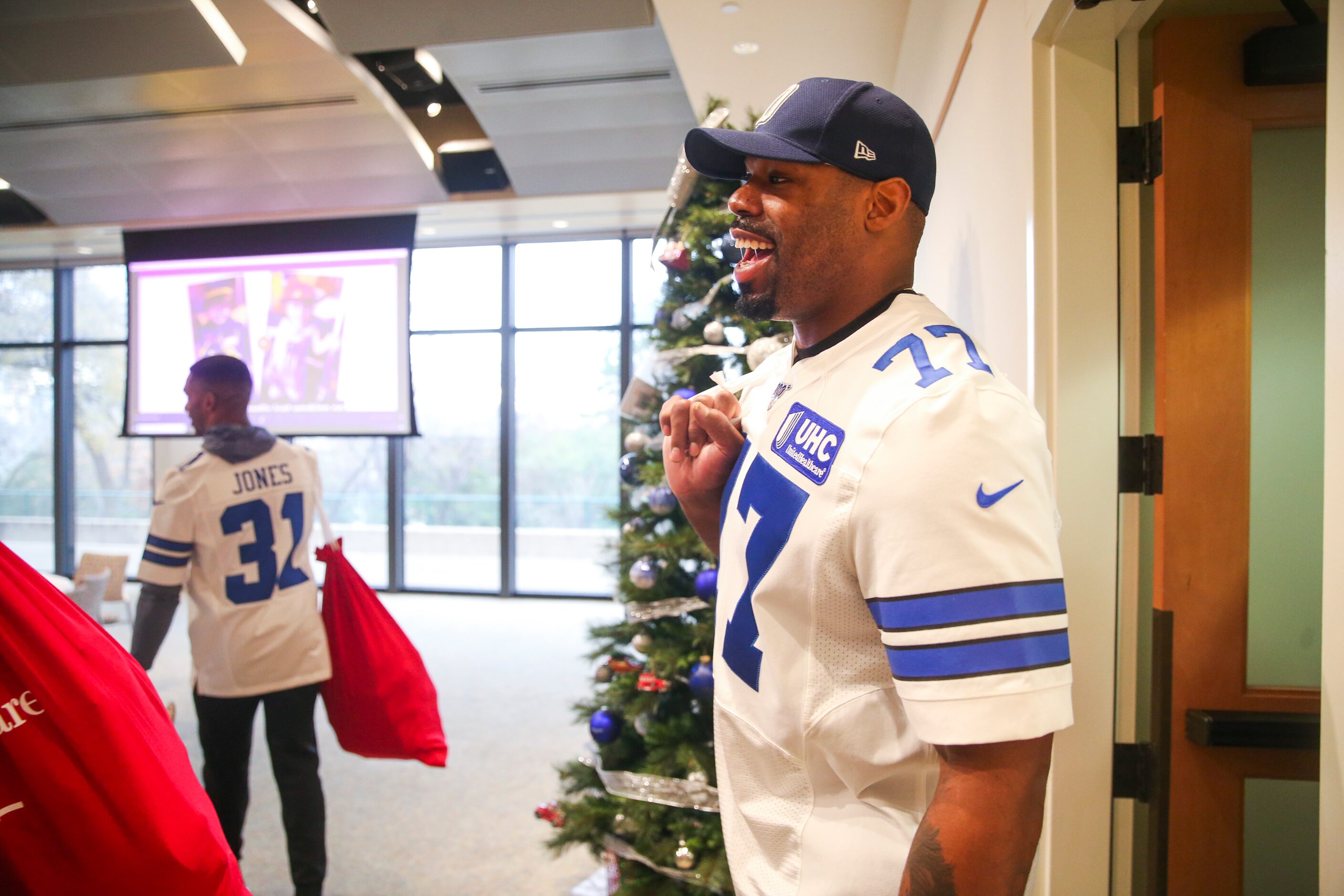 Dallas Cowboys offensive tackle Tyron Smith smiles as he arrives the teamâs annual holiday...