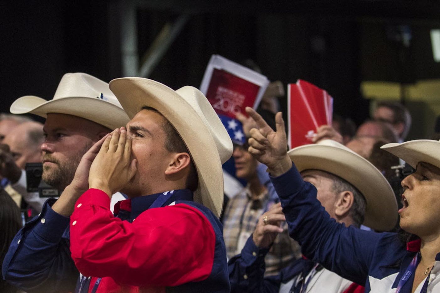 Texas delegates chant "Roll Call Vote" on the floor of the Republican National Convention on...