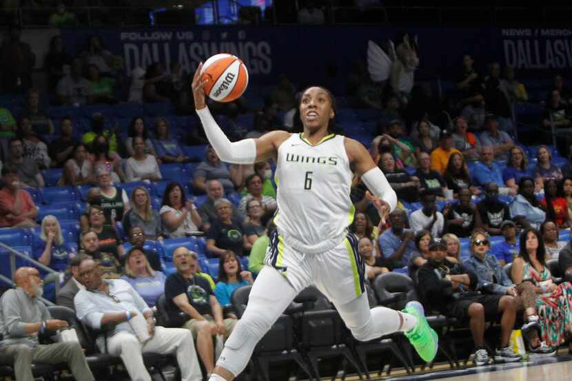Dallas Wings forward Kayla Thornton (6) races to the basket during a first half fast break...