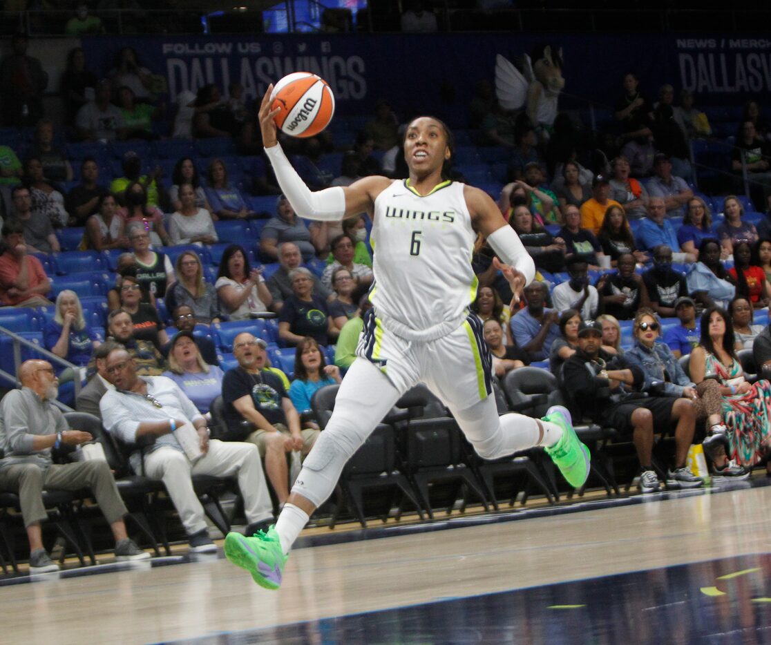 Dallas Wings forward Kayla Thornton (6) races to the basket during a first half fast break...