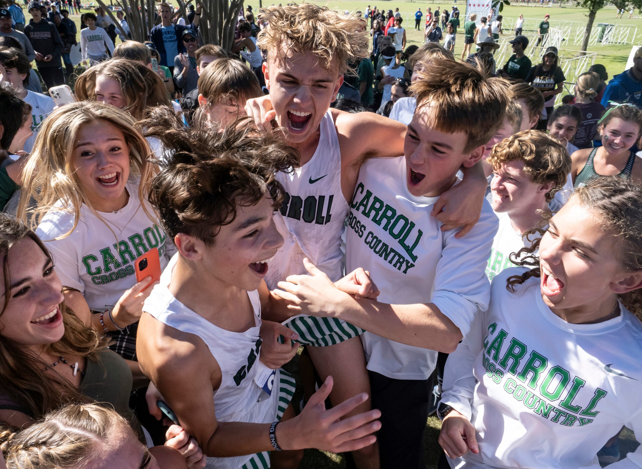 Southlake Carroll David Fisher, (2771), center, and teammate, Jude Alvarez, (2769), left,...