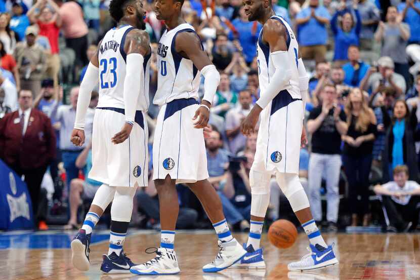 Dallas Mavericks guard Wesley Matthews (23) and forward Nerlens Noel (3) congratulate...