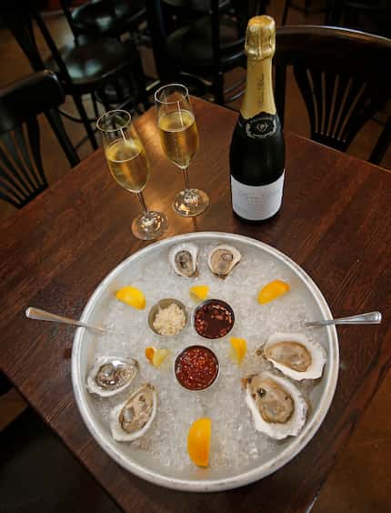 Six East Coast oysters are served with a bottle of Pierre Peters Champagne at Boulevardier...