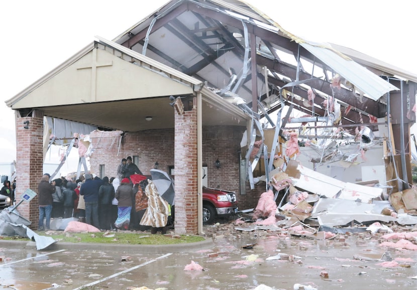 
The Rev. Kevin Taylor and his wife, Debra, prayed with members amid the devastation at...