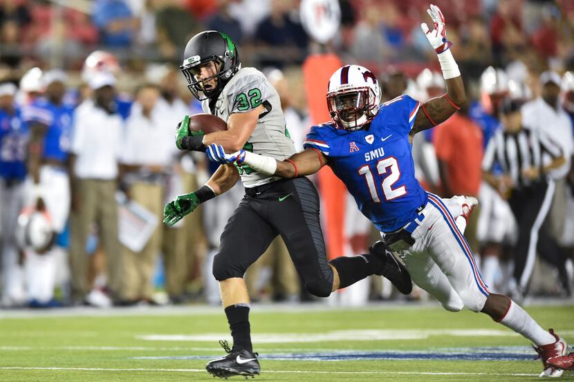 North Texas sophomore wide receiver Michael Lawrence (32)  catches a pass from North Texas...