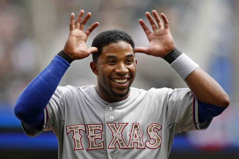 May 26, 2014; Minneapolis, MN, USA; Texas Rangers shortstop Elvis Andrus (1) jesters with...