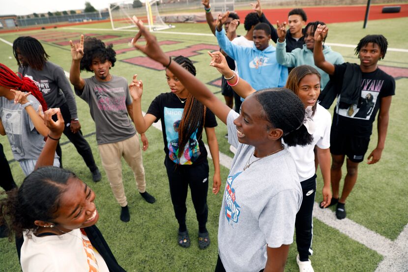 Mansfield Timberview's Taylor Fingers (center), who qualified for the UIL state meet in...