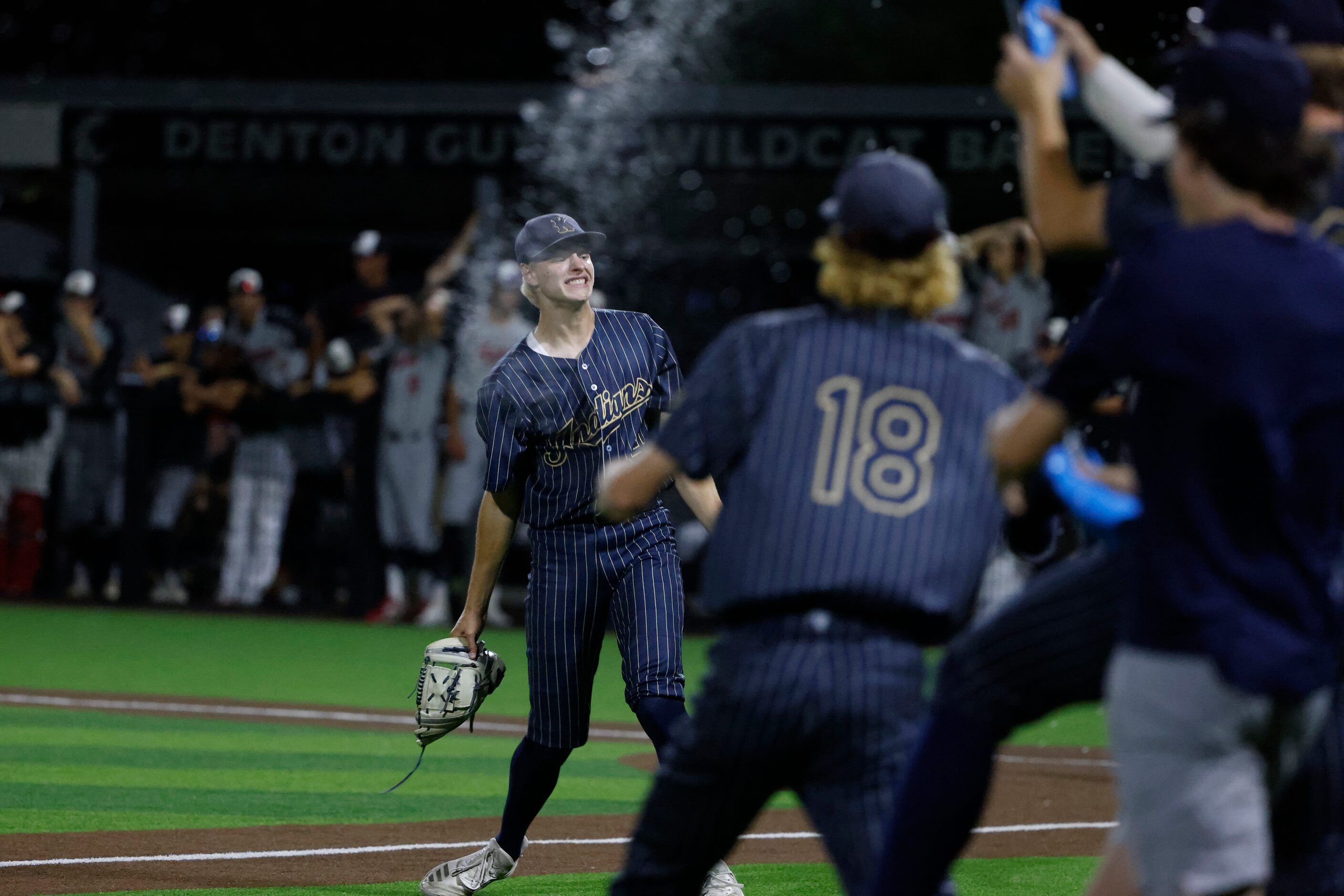 Keller pitcher Nicholas Robb (14) celebrates as they defeated Flower Mound Marcus 4-2 during...