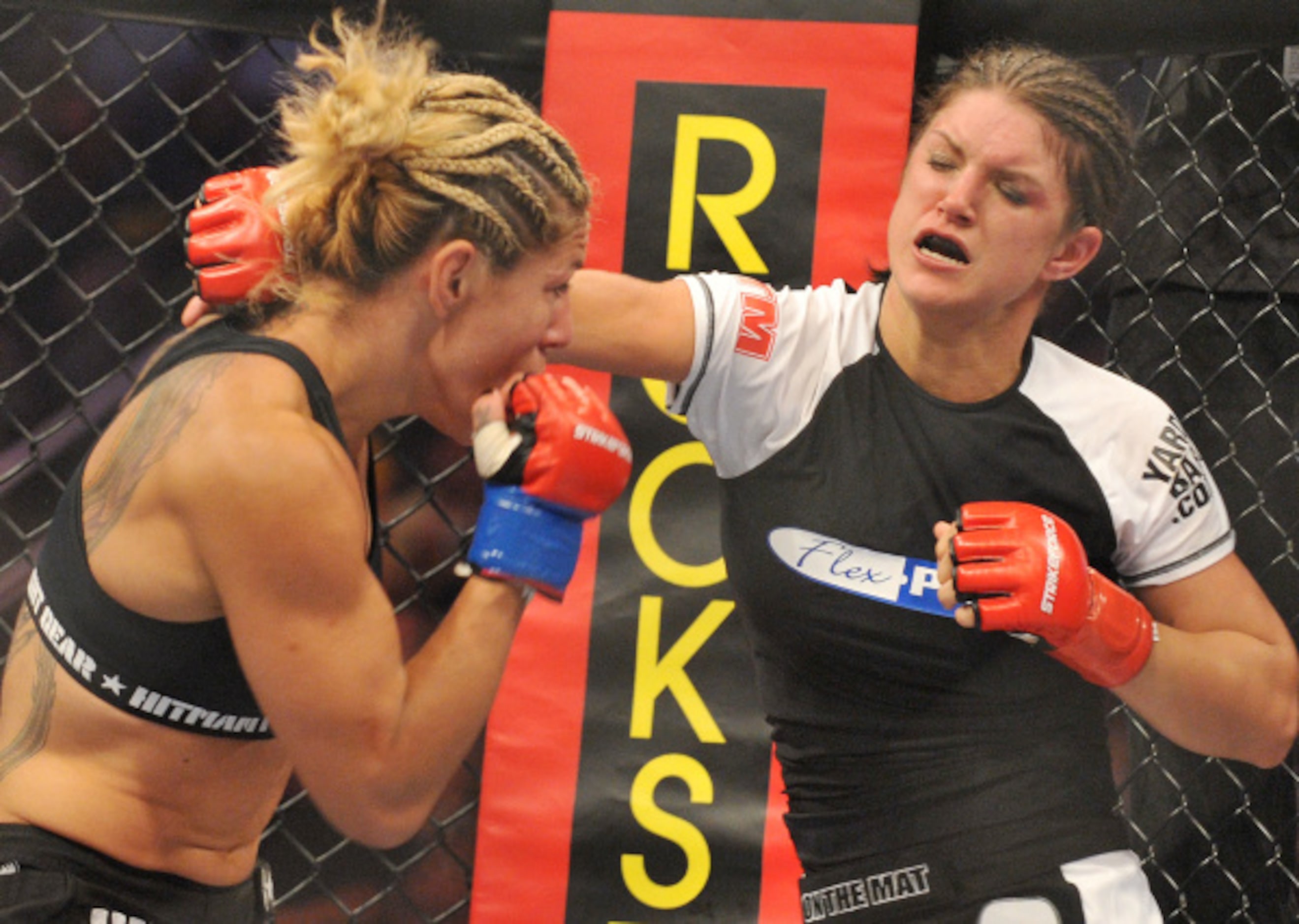 Cris Cyborg (L) battles Gina Carano during their Middleweight Championship fight at...