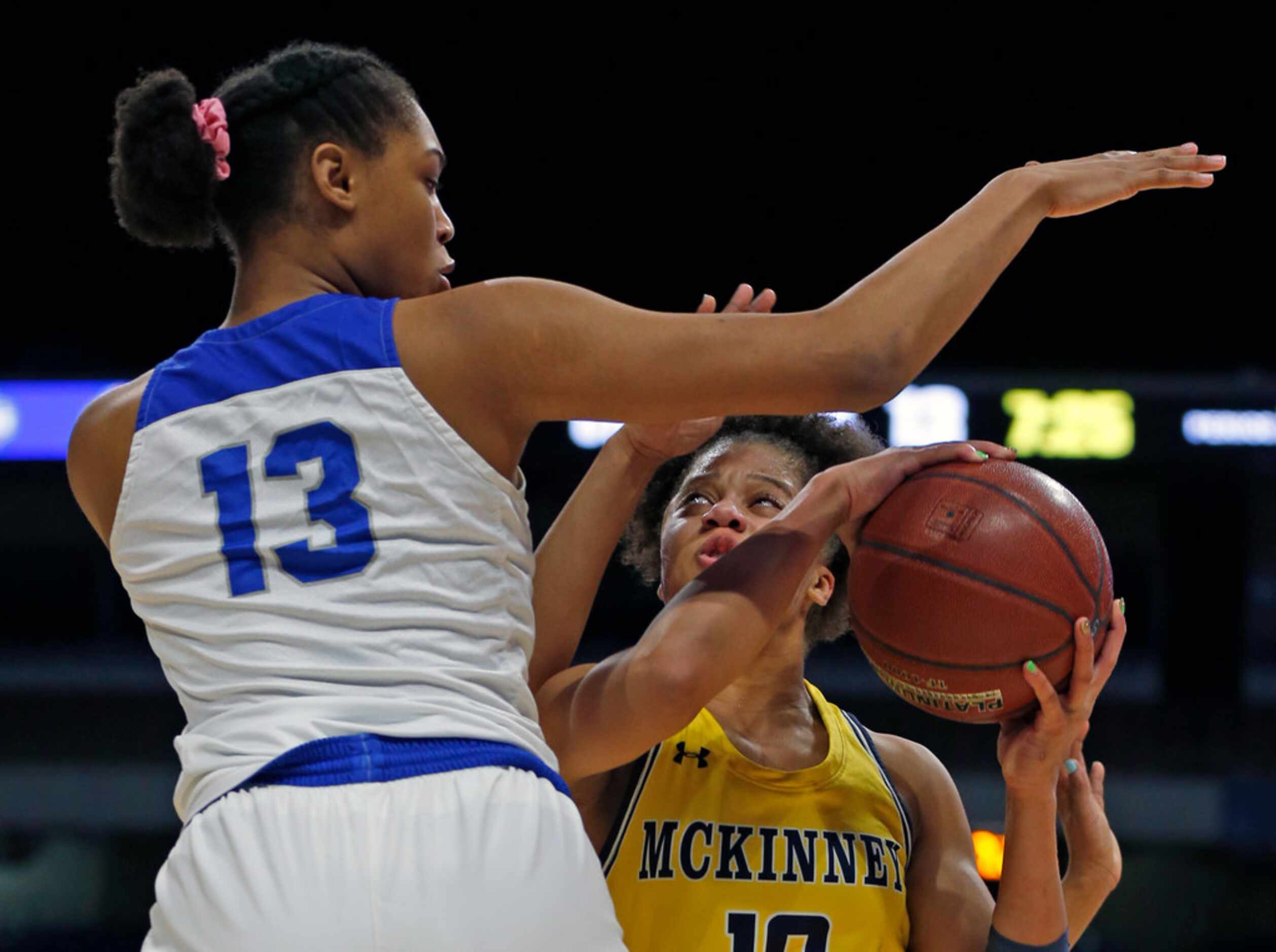 McKinney guard Erin Fry #10 drives on Cypress Creek forward Riyah Francis #13 in a 6A...