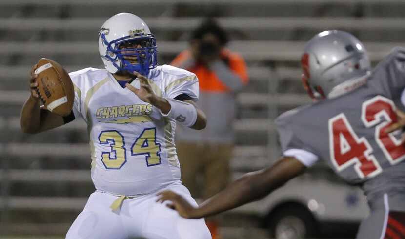 TXHSFB Woodrow Wilson junior defensive end Reece Albert (42) pressures Conrad junior...