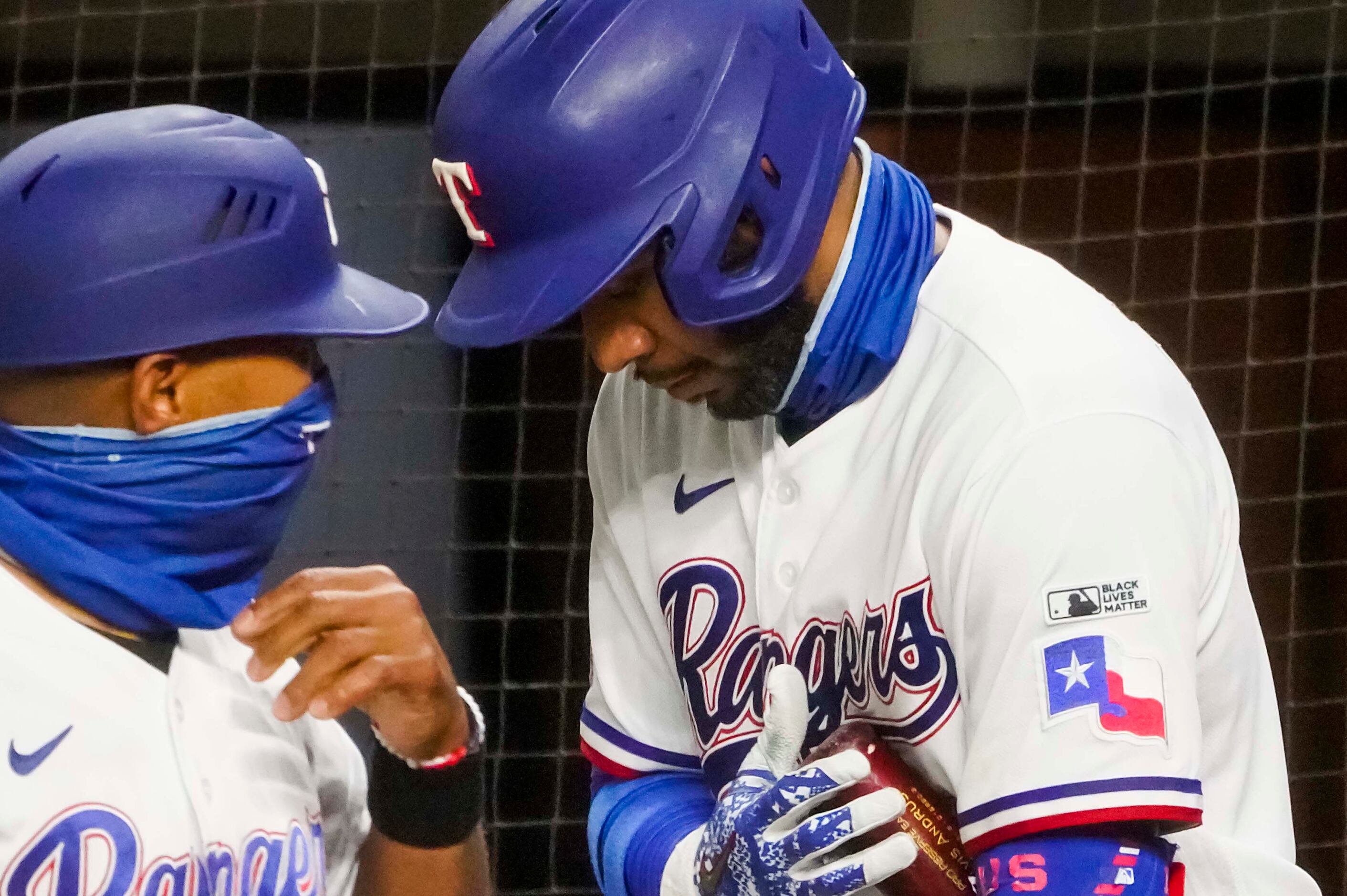 A Black Lives Matter patch is seen on the sleeve of Texas Rangers shortstop Elvis Andrus as...