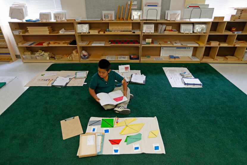 Second-grader Andres Tovar, 7, works on his classwork during a lower elementary dual...