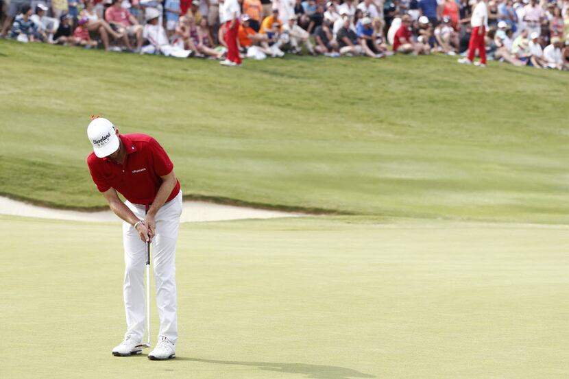 Keegan Bradley putts on the 18th hole during the final round of the Byron Nelson...