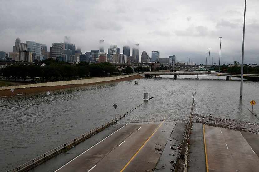 The downtown Houston skyline and flooded highway 288 are seen August 27, 2017 as the city...