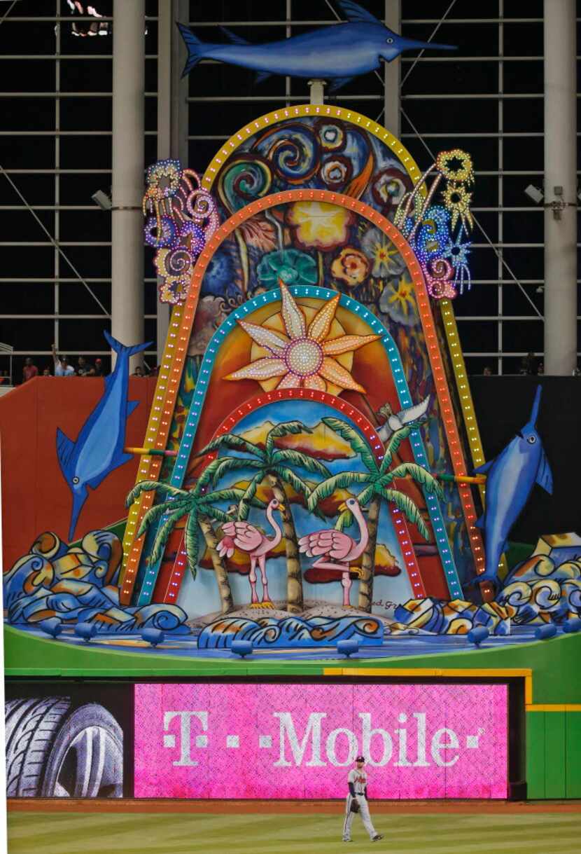 The Miami Marlins home run sculpture goes off after Miami Marlins' Marcell Ozuna hit a home...