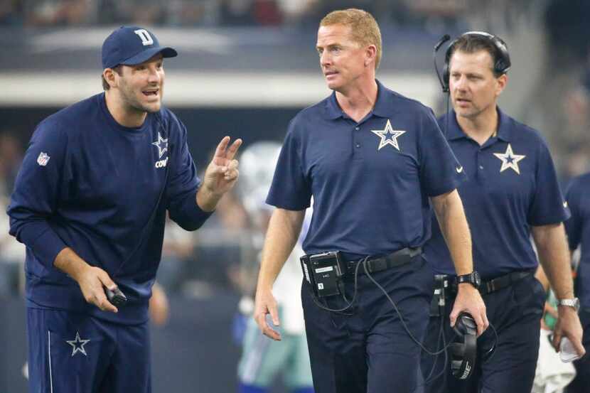 Dallas Cowboys quarterback Tony Romo, left, and head coach Jason Garrett are pictured during...