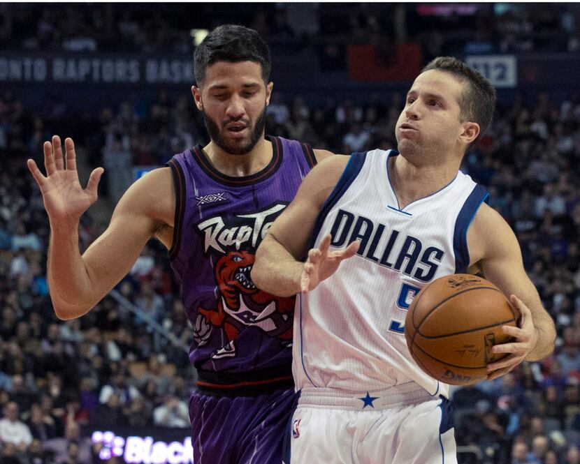 FILE -  In a Nov. 28, 2014, file photo Dallas Mavericks' Jose Juan Barea, right, is fouled...