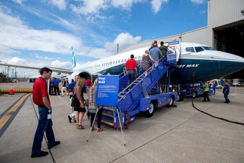 Southwest Airlines employees line up to have a first look at the new Boeing 737 MAX jetliner...