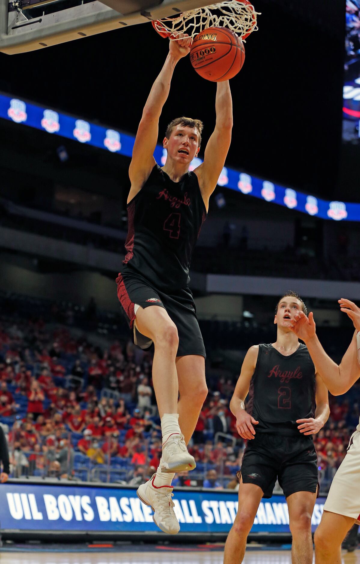 Argyle Nate Atwood #4 dunks against Hargrave. UIL boys Class 4A basketball state...