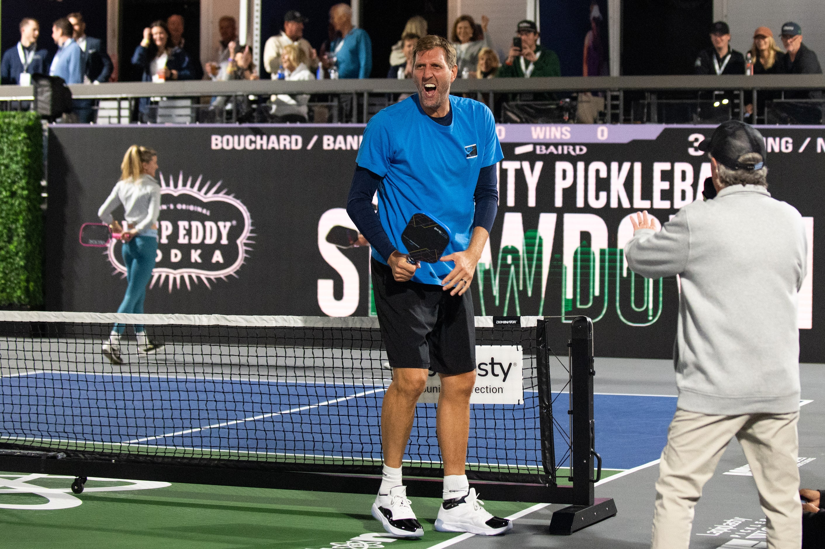 Former Dallas Mavericks center Dirk Nowitzki screams as he reacts after a swing during the...