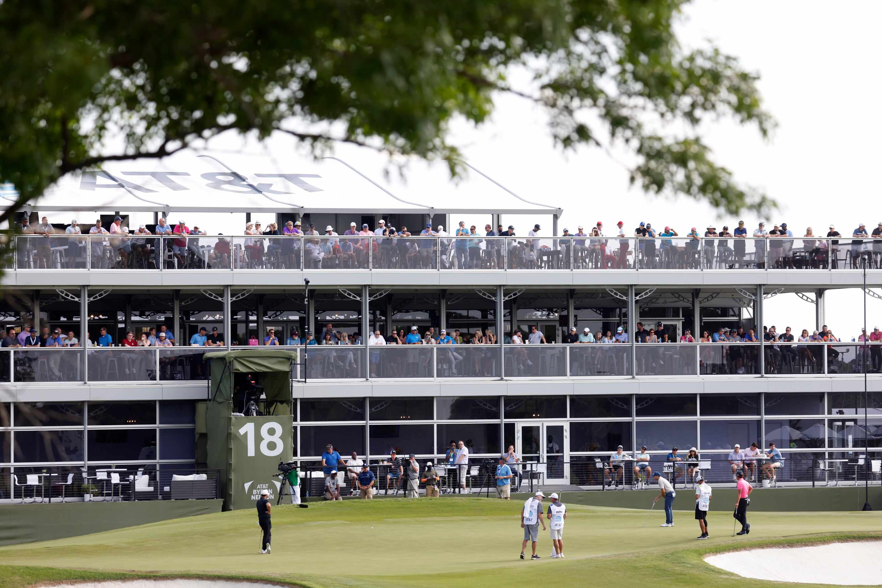 Fans watch action on the 18th hole during round 2 of the AT&T Byron Nelson  at TPC Craig...