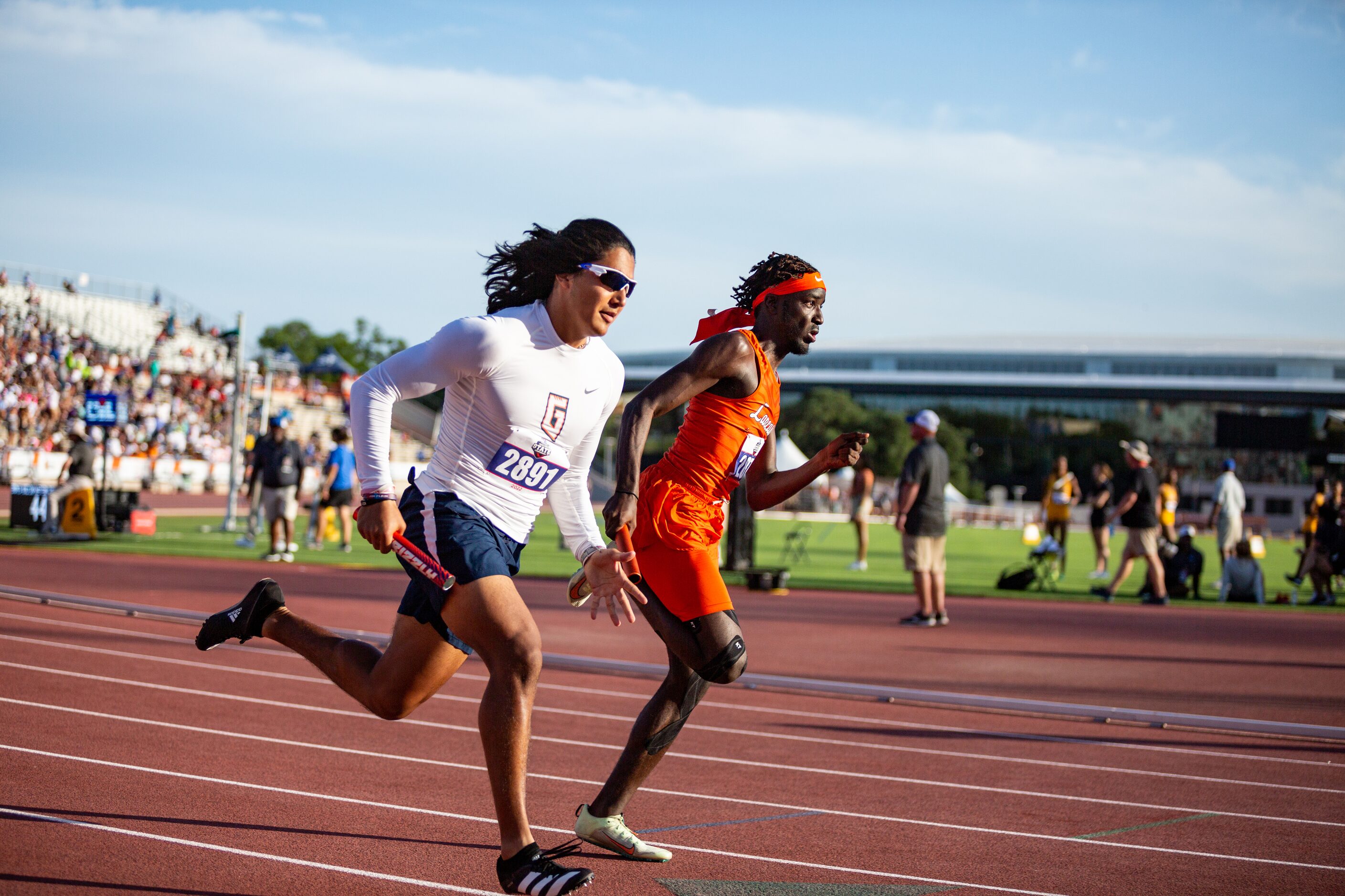 Lancaster’s Tomadric Jessie, right, competes in the boys’ 4x200 relay final at the UIL Track...