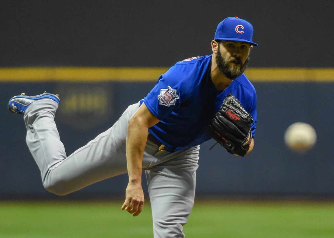 Oct 2, 2015; Milwaukee, WI, USA;  Chicago Cubs pitcher Jake Arrieta (49) pitches in the...