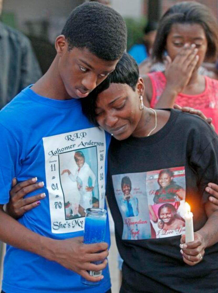 
Nycholas George and Angela Ravenell mourned slaying victim Lahomer Anderson during a...