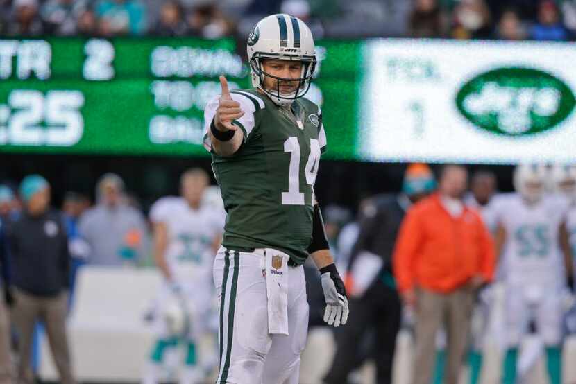 New York Jets quarterback Ryan Fitzpatrick (14) signals to the sideline during the first...