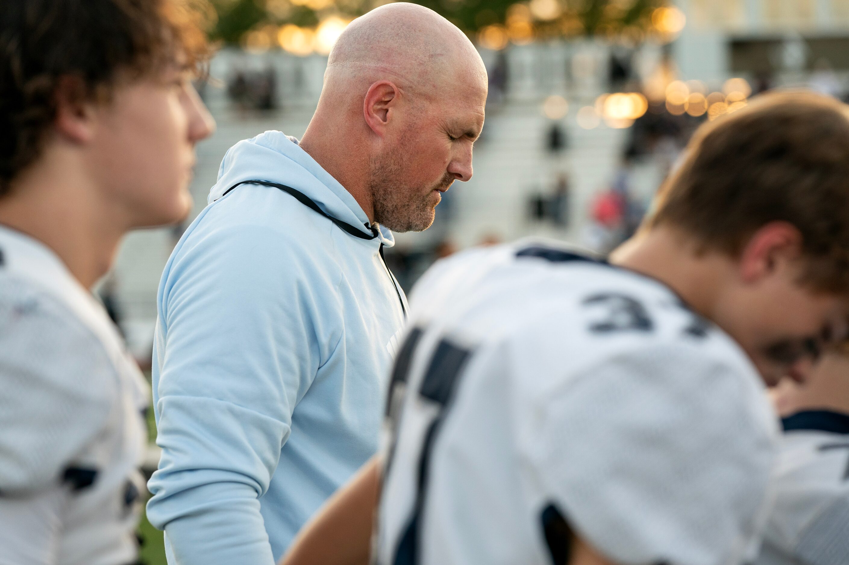 Former Dallas Cowboys great and Argyle Liberty Christian head coach Jason Witten prays with...