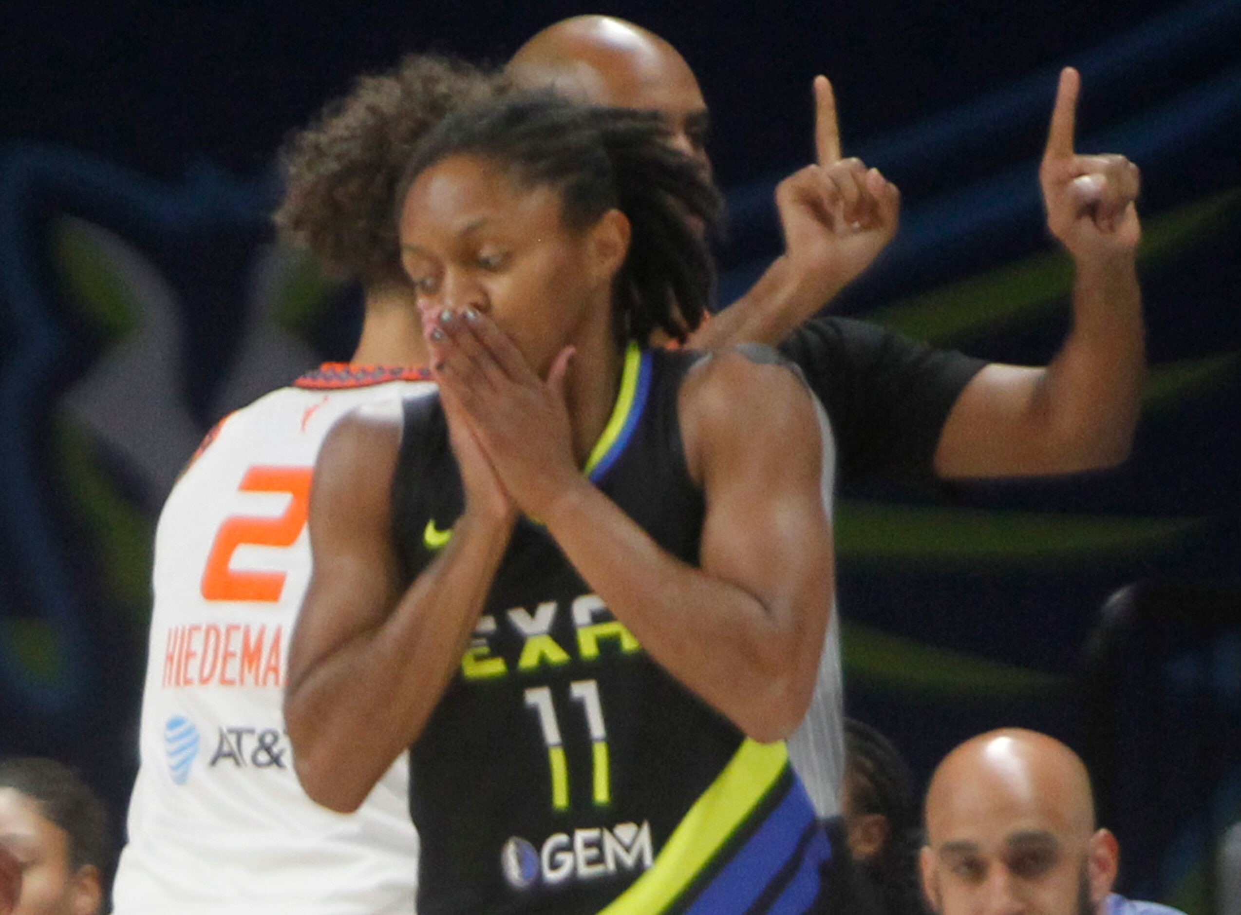 Dallas Wings guard Crystal Dangerfield (11) reacts after being called for a foul during...